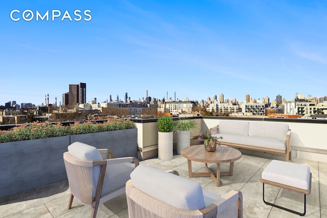 view of patio featuring a skyline view and an outdoor living space