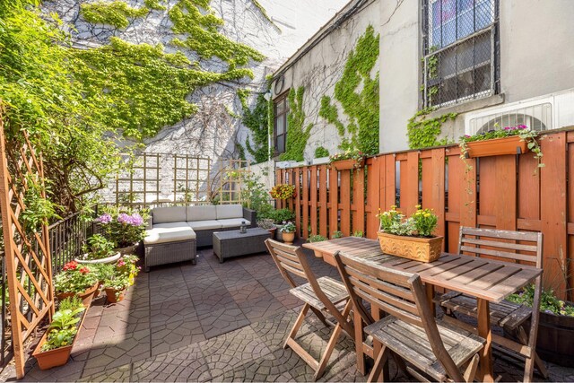 275 Degraw St Unit A, New York City, NY 11231 - fenced backyard with an outdoor hangout area, a patio area, and outdoor dining space