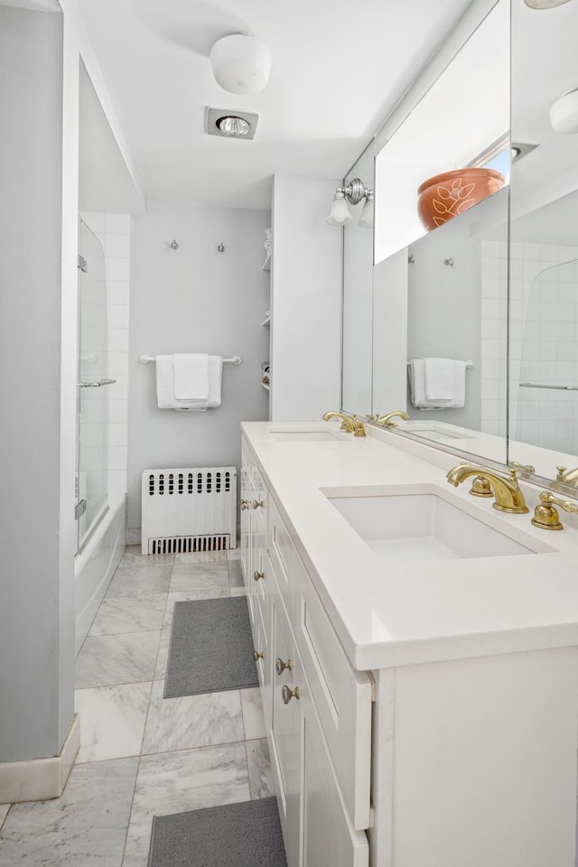 275 Degraw St Unit A, New York City, NY 11231 - bathroom with radiator, marble look tiles, vanity, and tub / shower combination