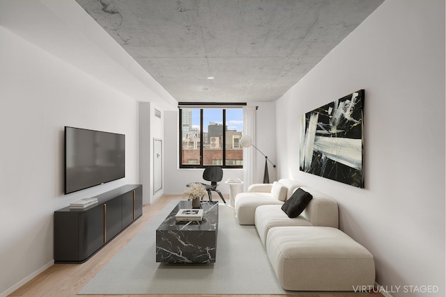 196 Orchard St Unit 7J, New York City, NY 10002 - living area with light wood-type flooring and baseboards