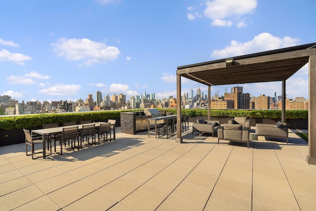 view of patio / terrace with a view of skyline, outdoor lounge area, and outdoor dining space