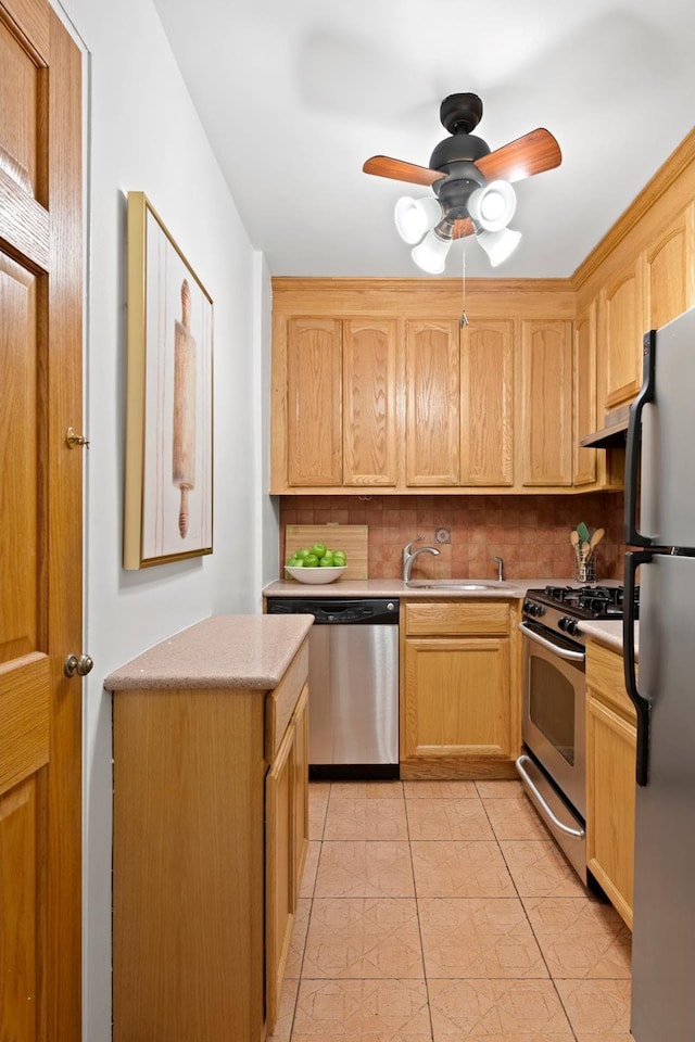 251 E 51st St Unit 3M, New York City, NY 10022 - kitchen with appliances with stainless steel finishes, a sink, light countertops, decorative backsplash, and light brown cabinets