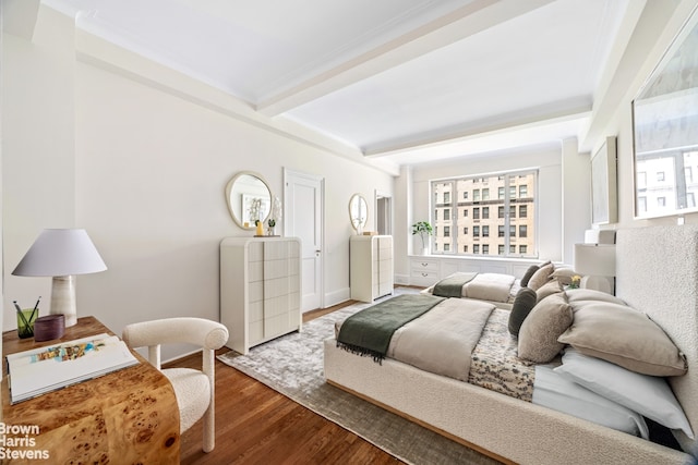 1095 Park Ave Unit 6D, New York City, NY 10128 - bedroom featuring wood finished floors, beam ceiling, and baseboards
