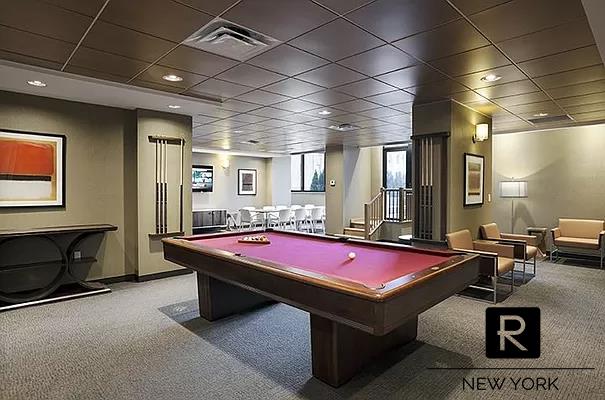 330 E 38th St Unit 48-E, New York City, NY 10016 - rec room with carpet, pool table, and baseboards