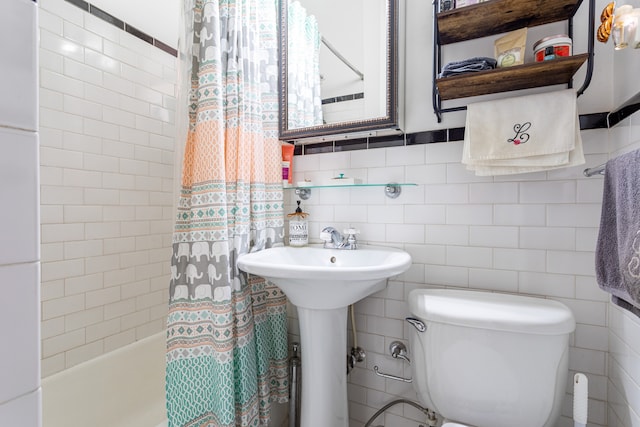 175 E 93rd St Unit 3-B, New York City, NY 10128 - bathroom with toilet, tile walls, shower / tub combo with curtain, and a sink