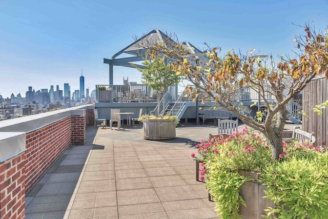 view of patio / terrace with a skyline view and a wooden deck