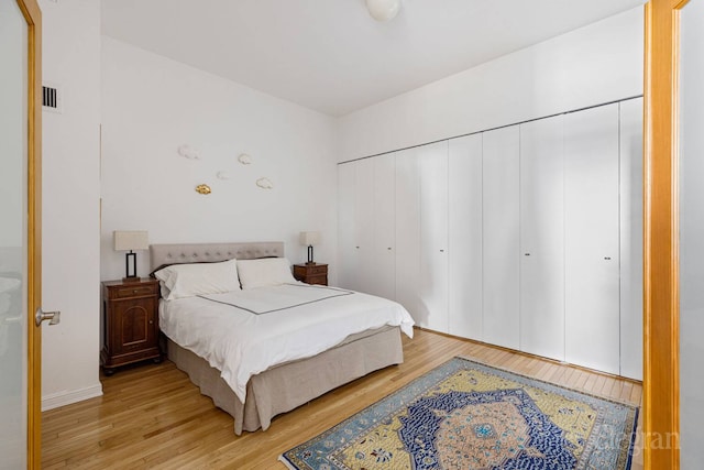 bedroom featuring light wood finished floors