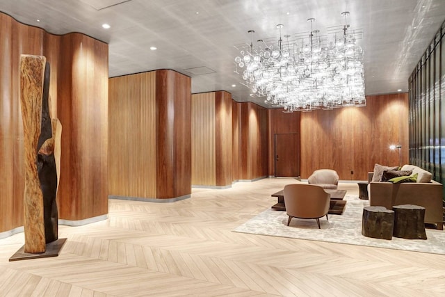 community lobby with wooden walls and recessed lighting