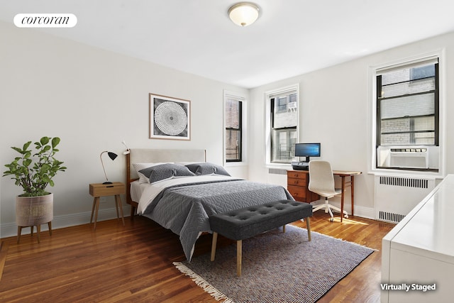 45 Martense St Unit 5L, New York City, NY 11226 - bedroom with radiator, wood finished floors, and baseboards