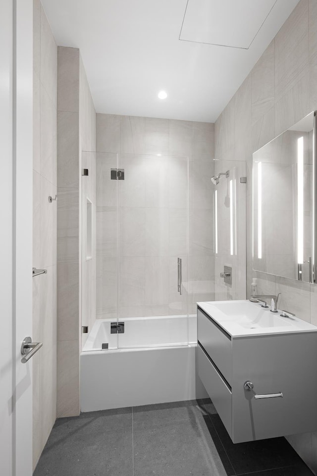 bathroom with washtub / shower combination and vanity