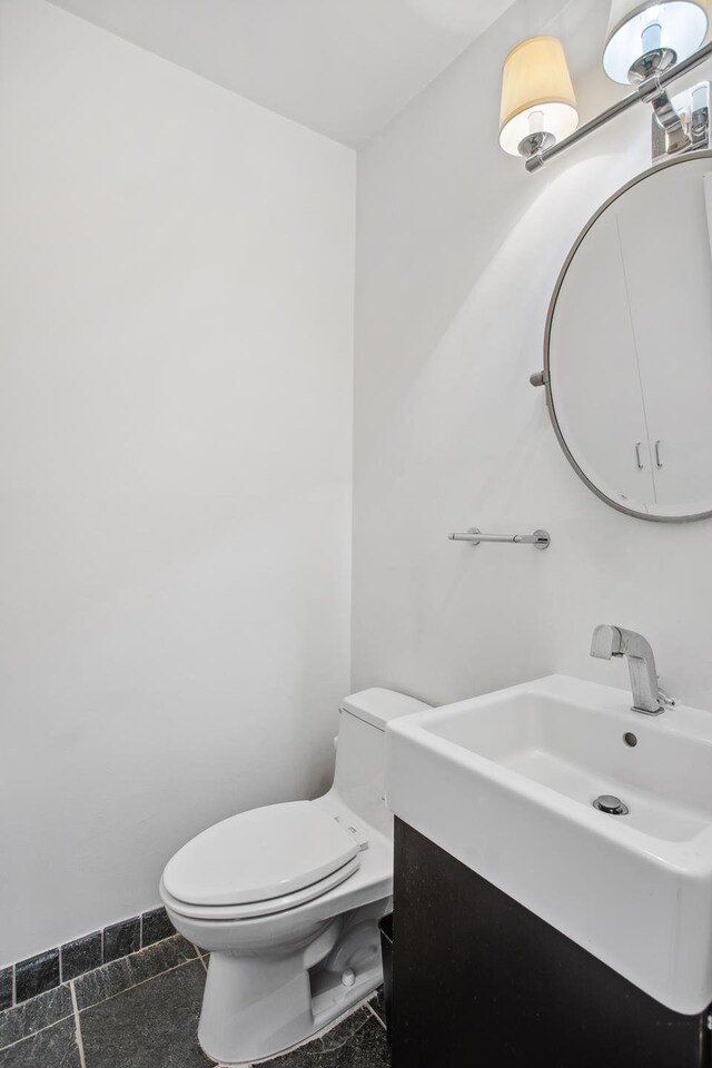 347 W 57th St Unit 3F, New York City, NY 10019 - half bathroom featuring toilet and vanity