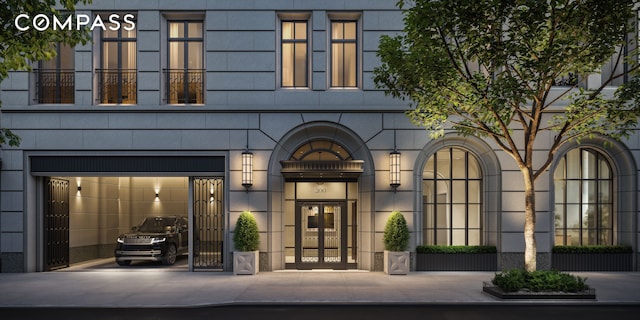 200 E 75th St Unit 11B, New York City, NY 10021 - view of exterior entry with french doors and driveway