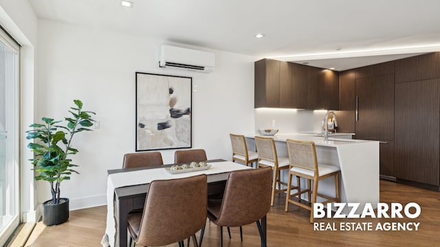 553 W 182nd St Unit 3R, New York City, NY 10033 - dining room with an AC wall unit, wood finished floors, and recessed lighting