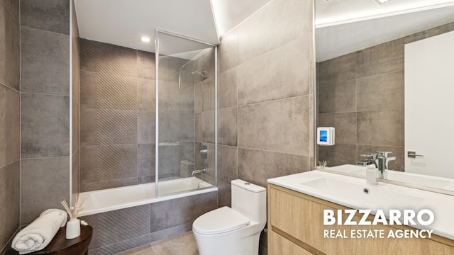 553 W 182nd St Unit 3R, New York City, NY 10033 - full bathroom featuring tile walls, tiled shower / bath, and vanity
