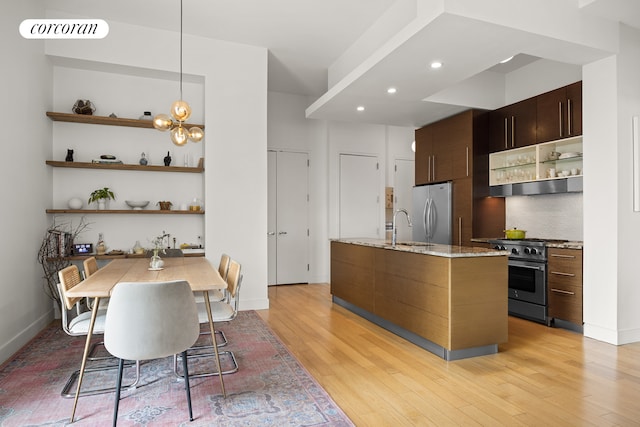 96 Rockwell Pl Unit 11C, New York City, NY 11217 - kitchen with appliances with stainless steel finishes, open shelves, light wood finished floors, a sink, and recessed lighting