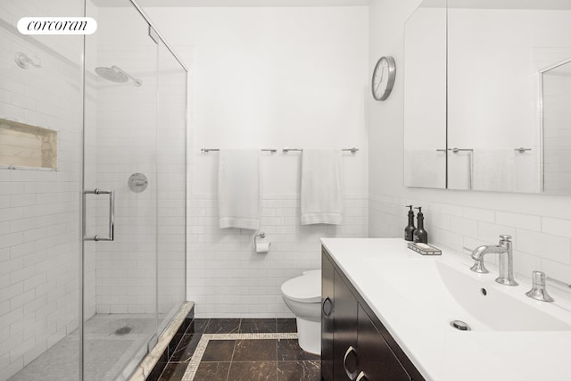 96 Rockwell Pl Unit 11C, New York City, NY 11217 - bathroom with a shower stall, toilet, vanity, and tile walls
