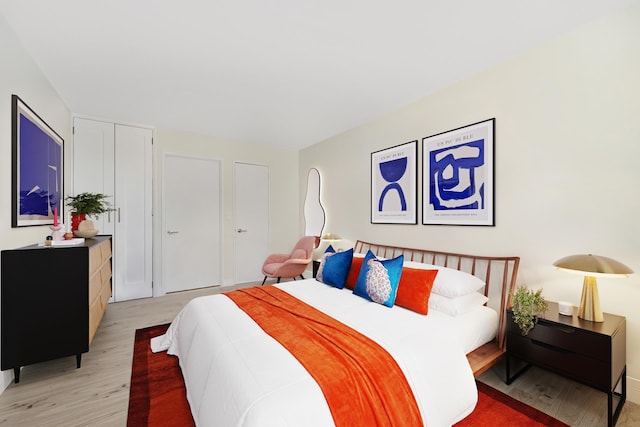 415 E 37th St Unit 31D, New York City, NY 10016 - bedroom featuring light wood-type flooring and a closet