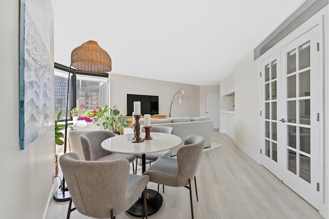 415 E 37th St Unit 31D, New York City, NY 10016 - dining area with wood finished floors and baseboards