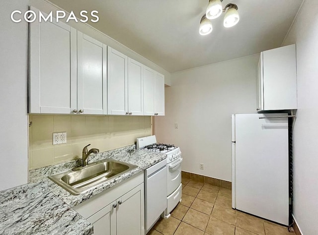 53 E 7th St Hse, Unit Hse, New York City, NY 10003 - kitchen with white appliances, a sink, white cabinetry, and light countertops