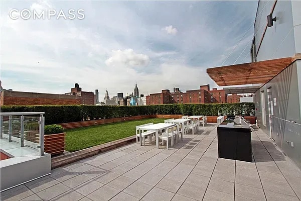 425 E 13th St Unit 5G, New York City, NY 10009 - view of patio with outdoor dining area and a city view