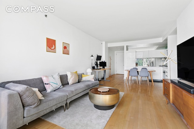 425 E 13th St Unit 5G, New York City, NY 10009 - living room featuring light wood-style floors and an office area
