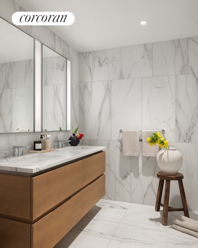 bathroom featuring marble tiled flooring and double vanity