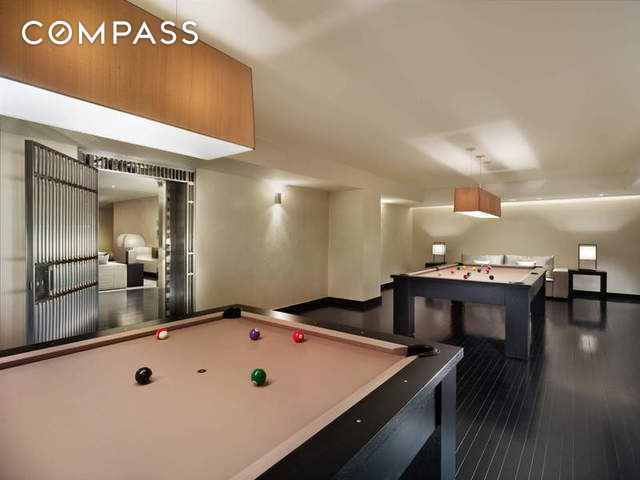 20 Pine St Unit 2905, New York City, NY 10005 - rec room with billiards table and dark wood finished floors