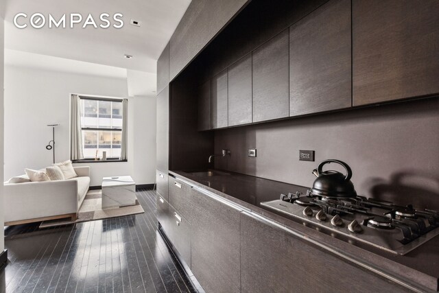 20 Pine St Unit 2905, New York City, NY 10005 - kitchen with a sink, dark wood finished floors, modern cabinets, dark countertops, and open floor plan