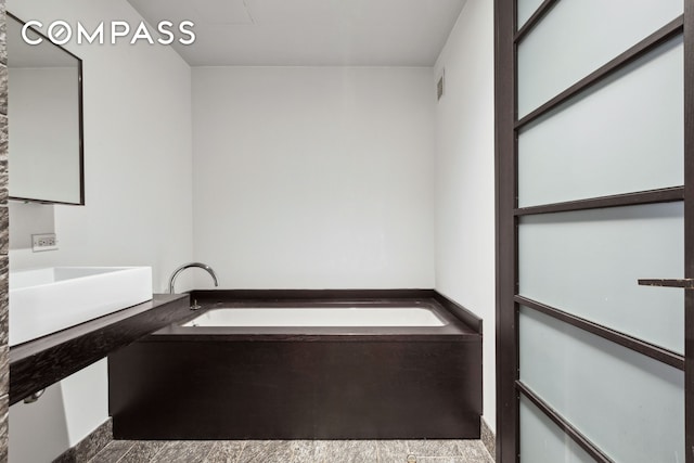 20 Pine St Unit 2905, New York City, NY 10005 - bathroom featuring a garden tub