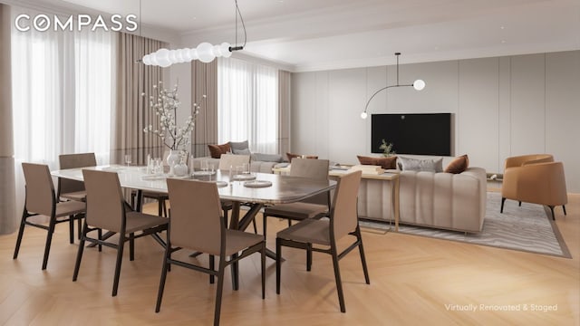 dining area with ornamental molding