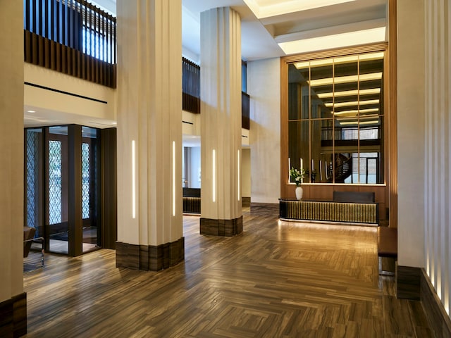 common area with a towering ceiling