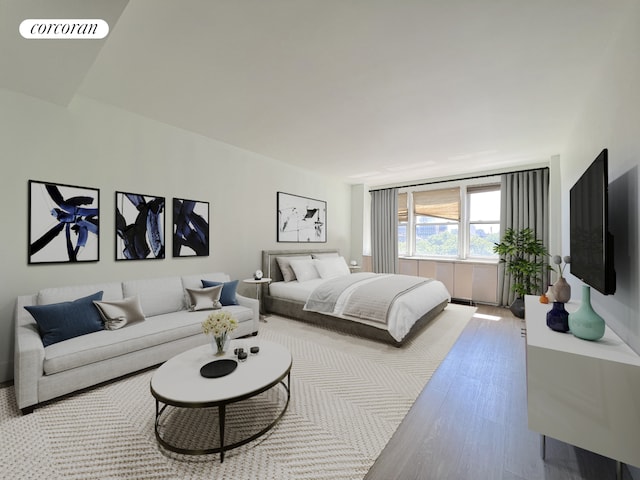 bedroom with wood finished floors