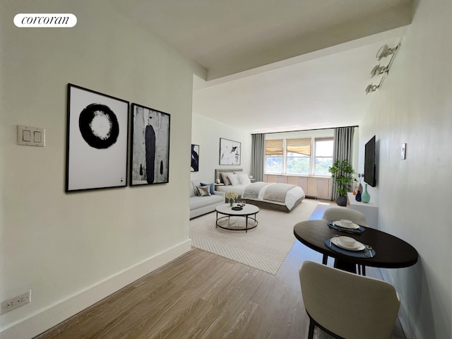living room featuring wood finished floors and baseboards