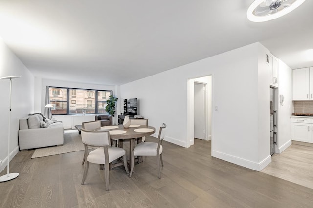 77 W 55th St Unit 2H, New York City, NY 10019 - dining area with light wood finished floors
