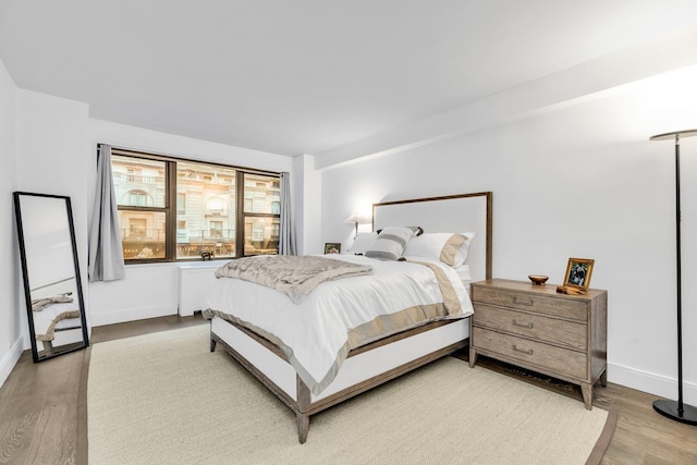 77 W 55th St Unit 2H, New York City, NY 10019 - bedroom featuring light wood-type flooring