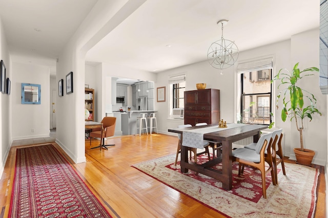 80 Winthrop St Unit 4C, New York City, NY 11225 - dining area featuring baseboards, a chandelier, and cooling unit