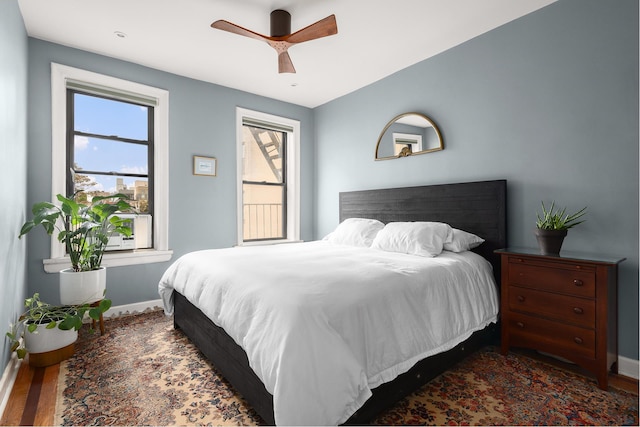 80 Winthrop St Unit 4C, New York City, NY 11225 - bedroom featuring baseboards, wood finished floors, and a ceiling fan