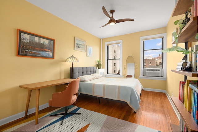 80 Winthrop St Unit 4C, New York City, NY 11225 - bedroom featuring wood finished floors, baseboards, cooling unit, and a ceiling fan