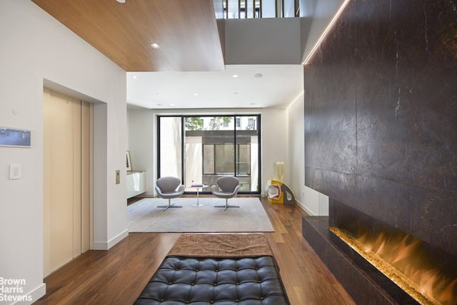 251 E 61st St, New York City, NY 10065 - exercise room featuring wood finished floors, recessed lighting, and baseboards