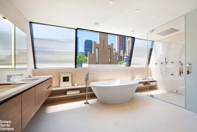 251 E 61st St, New York City, NY 10065 - bathroom with a shower stall, double vanity, a soaking tub, and a city view