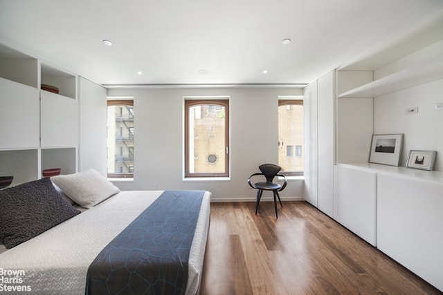 251 E 61st St, New York City, NY 10065 - bedroom featuring wood finished floors, recessed lighting, and baseboards