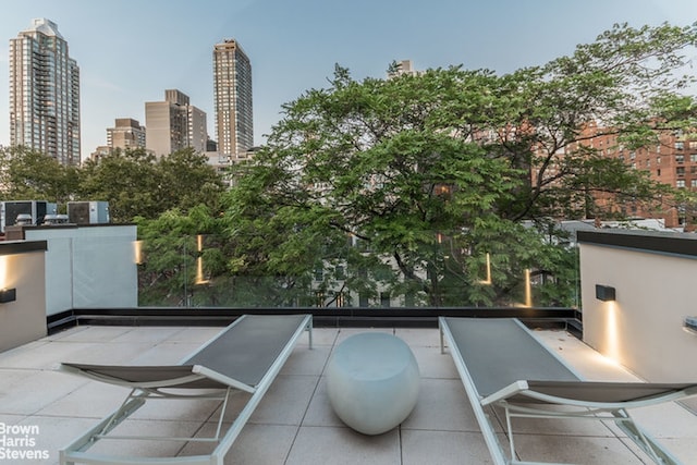 251 E 61st St, New York City, NY 10065 - view of patio / terrace featuring a balcony and a skyline view