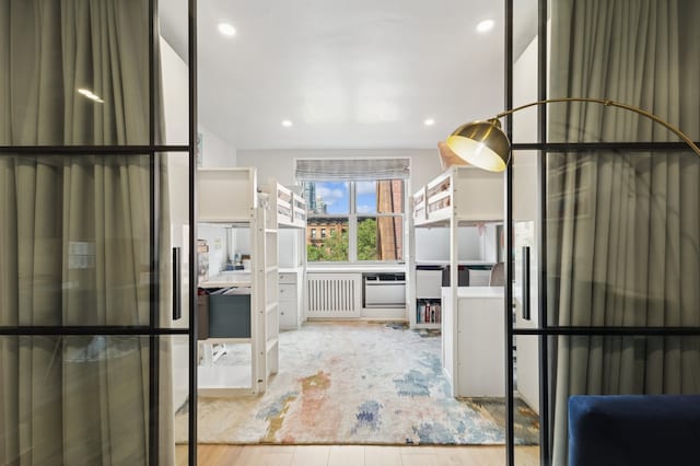 bathroom featuring recessed lighting and wood finished floors