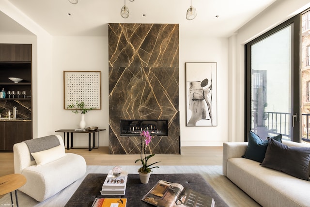 48 W 85th St, New York City, NY 10024 - living room with wood finished floors, healthy amount of natural light, and a fireplace