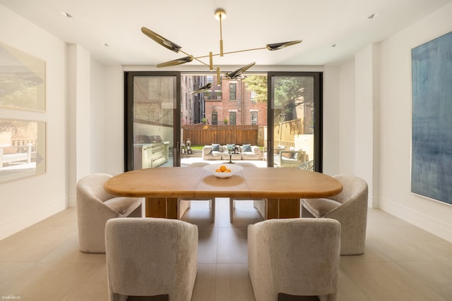 48 W 85th St, New York City, NY 10024 - dining area with a chandelier, light tile patterned floors, and baseboards