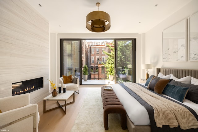 48 W 85th St, New York City, NY 10024 - bedroom with wood finished floors and a high end fireplace