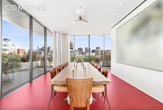 27 Wooster St Ph, Ph, New York City, NY 10013 - dining space with a view of skyline, a chandelier, and floor to ceiling windows