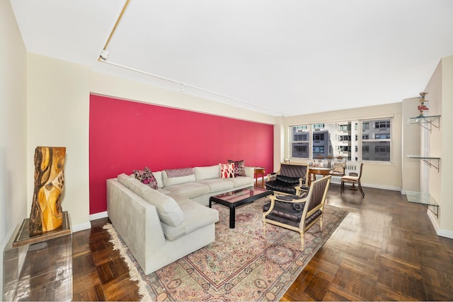 living room featuring baseboards