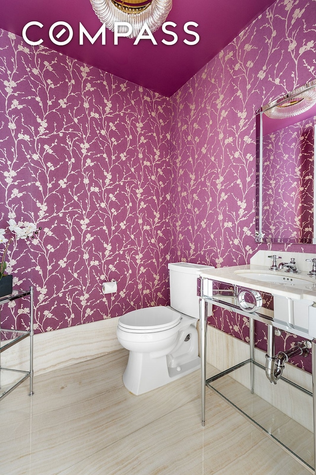 30 Park Pl Unit 64A, New York City, NY 10007 - half bath with wallpapered walls and vanity