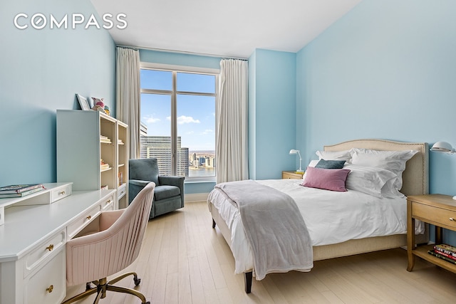 30 Park Pl Unit 64A, New York City, NY 10007 - bedroom with an office area and light wood-type flooring